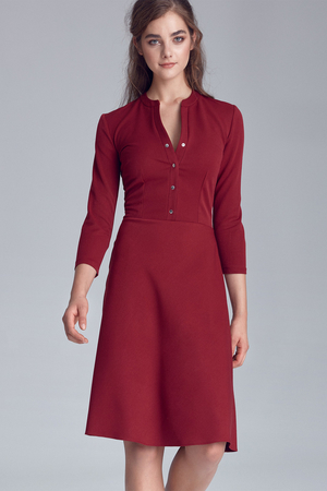 Dámské elegantní jednobarevné šaty se zapínáním na patentky mají sukni v midi délce a tříčtvrteční rukávy.
